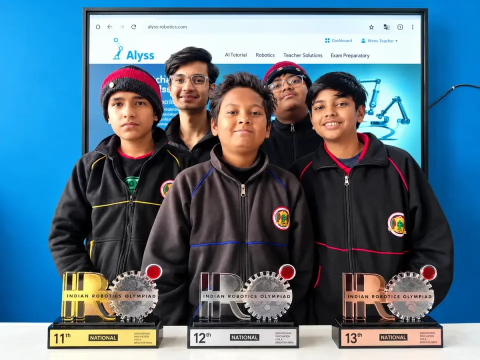 Students with their Indian Robotics Olympiad trophies