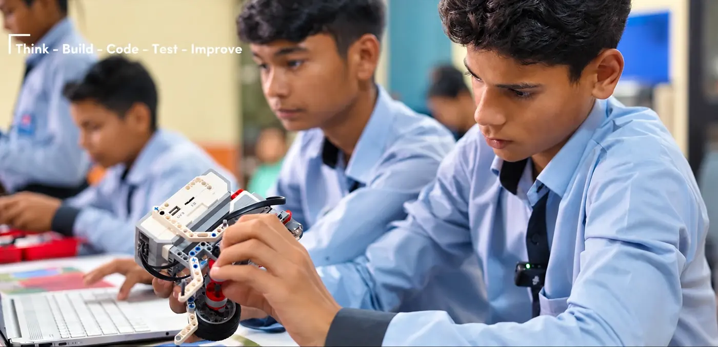 Students building and testing a robot